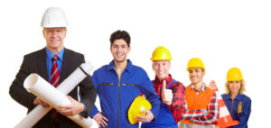 Team of an architect and construction workers working together